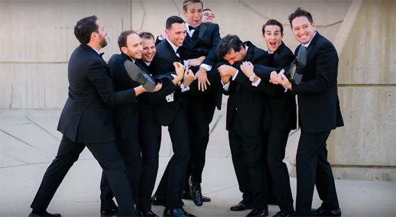 Group Huddle Celebrating Brotherhood pose for groom